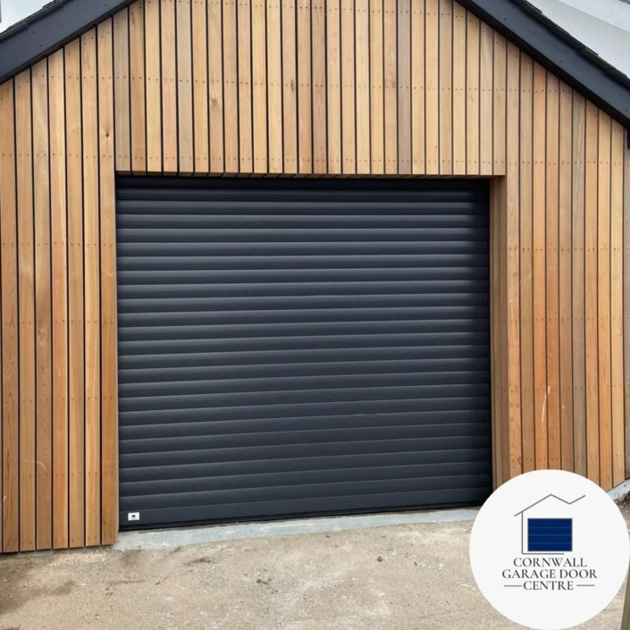 An Anthracite Grey Garage Door by SWS Original Insulated Roller, featuring durable construction and sleek design, perfectly complementing any modern or traditional home exterior.