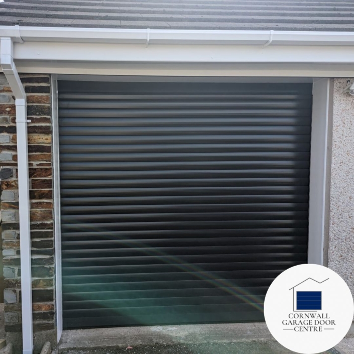 Image showcasing an SWS Insulated Roller Garage Door, featuring sleek design and durable construction. The door is closed, highlighting its smooth surface and modern appearance. The insulation properties are evident, ensuring energy efficiency and temperature regulation within the garage space.