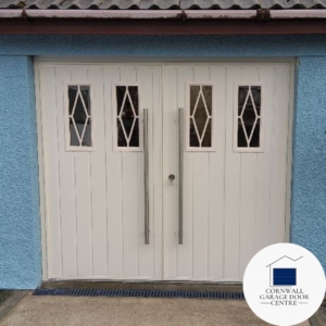 Image showcasing Teckentrup's Side Hinged Garage Doors featuring the Standard Vertical Ribbed design with Rectangle Rhombus windows. The doors are elegantly crafted with attention to detail, offering both functionality and aesthetic appeal for your garage space.