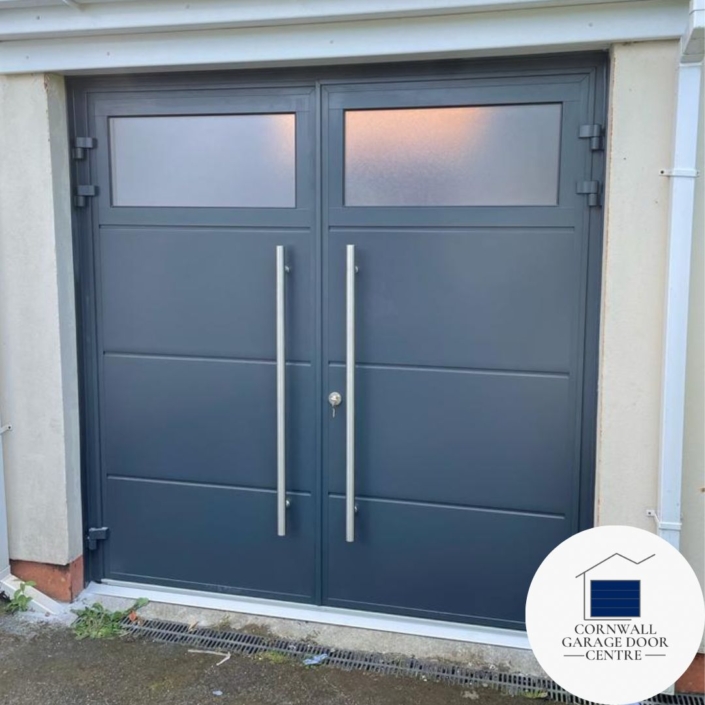 Tekentrup insulated Side Hinged Garage Doors featuring a sleek Anthracite grey finish and solid horizontal rib design, complemented by stylish GSA windows.