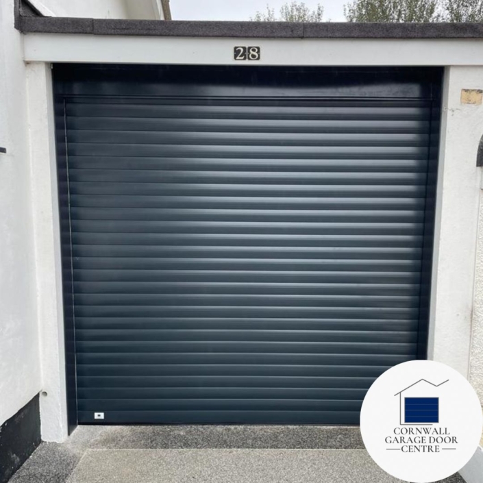 An SWS Original Insulated Roller Garage Door, showcasing its sleek design and robust construction. The door is securely closed, offering reliable protection and insulation for the garage space. Its modern appearance adds aesthetic appeal to any home exterior.